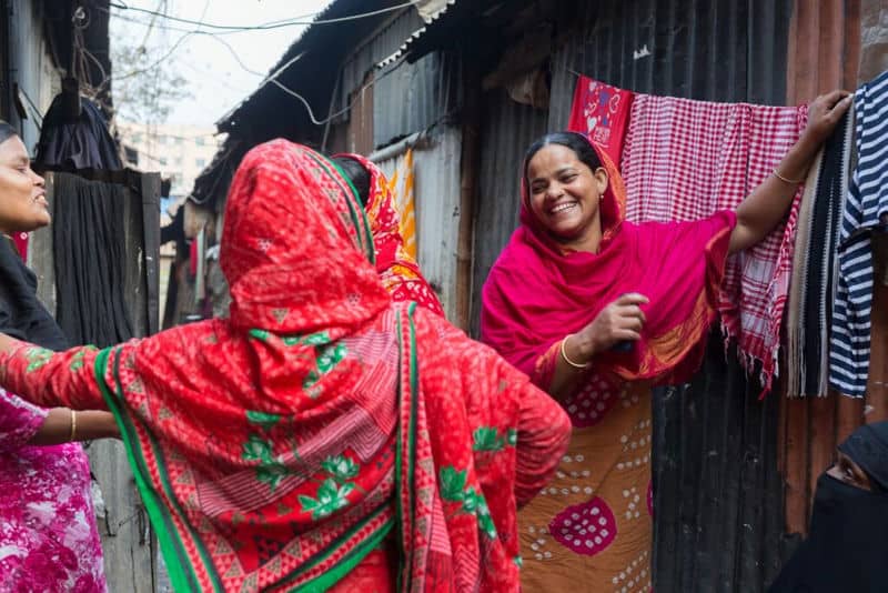 Climate migrant Saleha with her neighbor friend