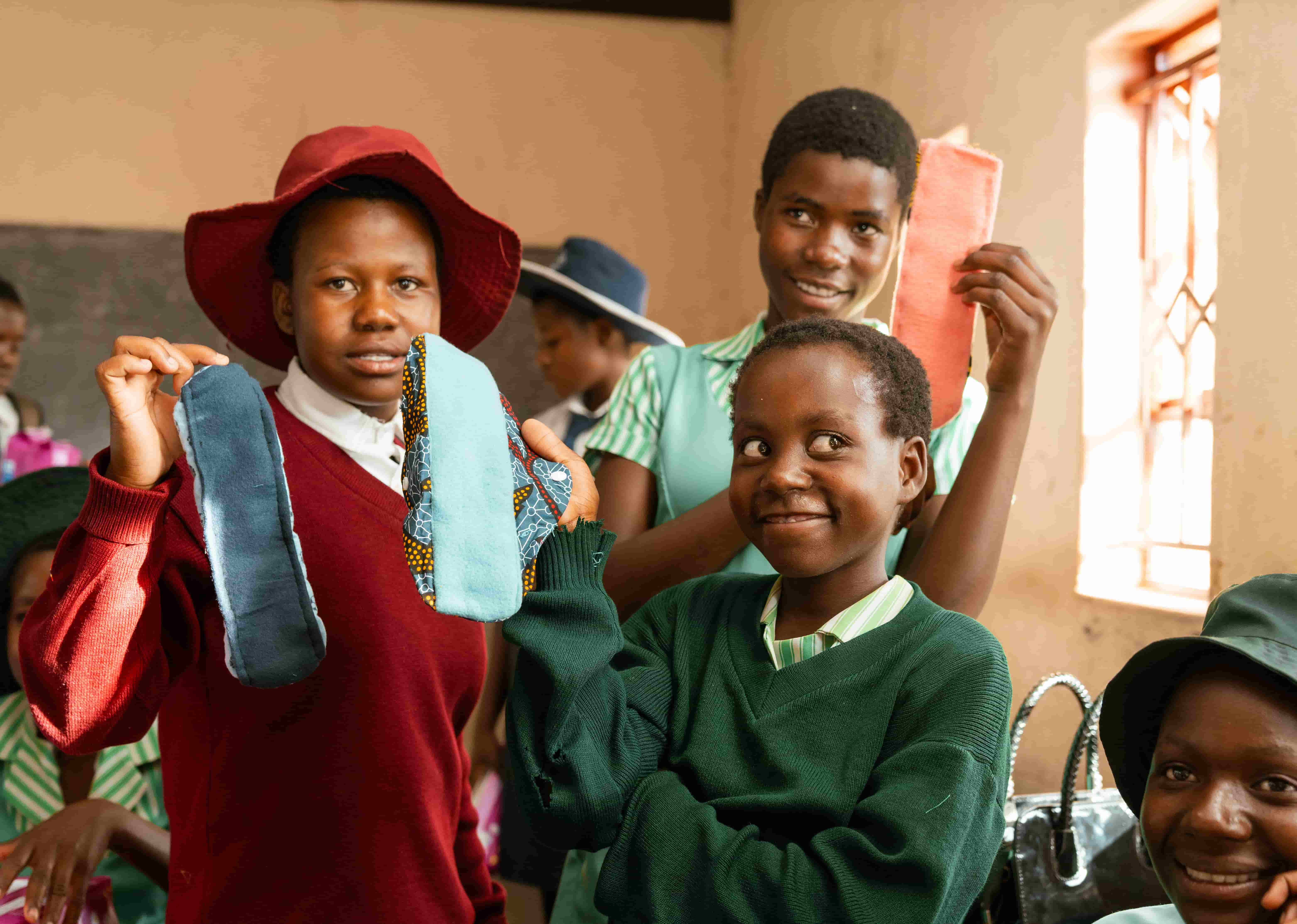 Makanaka and her fellow students with some of the reusable pads they’ve learnt to supporters like you!