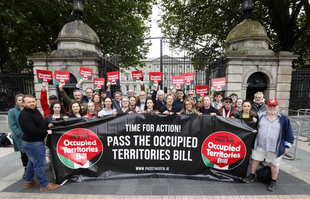 45 member organisations and groups of the Pass the Occupied Territories Bill Coalition pictured outside Leinster House urging the Irish Government to fulfil their commitment and pass the bill in full, without further delay.