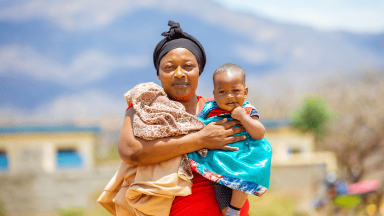 A woman holding her happy baby