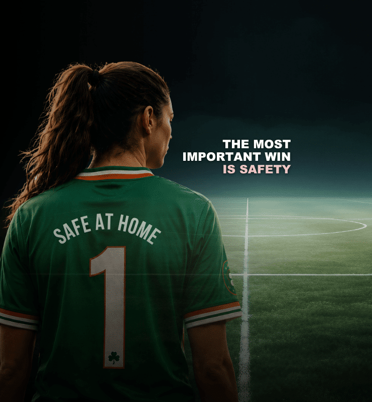 The most important win is safety. A woman wearing a jersey written Safe at Home.