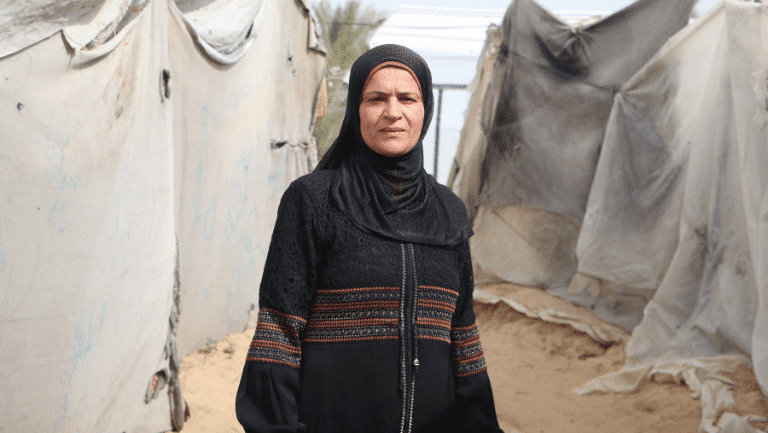  Taghreed - A survivor of conflict and displacement in the middle of the tents in Gaza.
